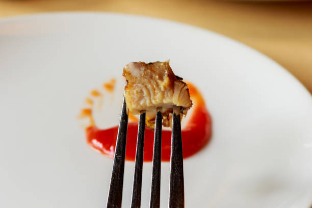 istock meat steak stab in fork dipping spicy sauce 866635928