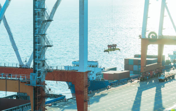 istock row of giant cranes at freight terminal 866636420