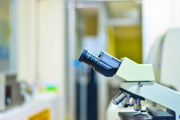 istock Blurred microscope medical technology equipment in blue tone. 866638630