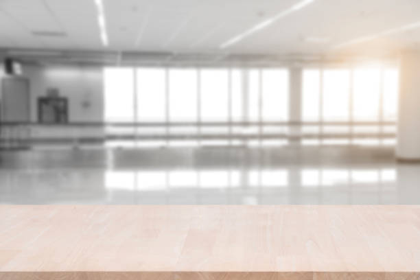 istock top empty wood table on blurred abstract hallway background. can be used for display or montage your product. 866643806