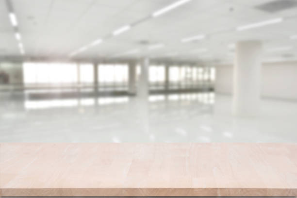 istock top empty wood table on blurred abstract hallway background. can be used for display or montage your product. 866643922