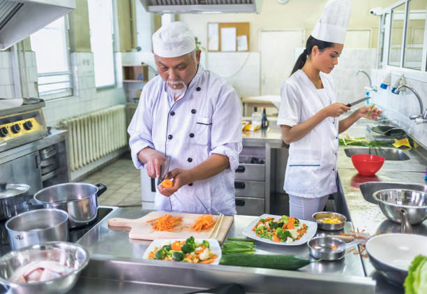 istock Chef and female assistant in chinese restaurant 866644036