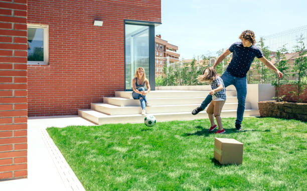 istock Mother watching her husband and son playing 866647218