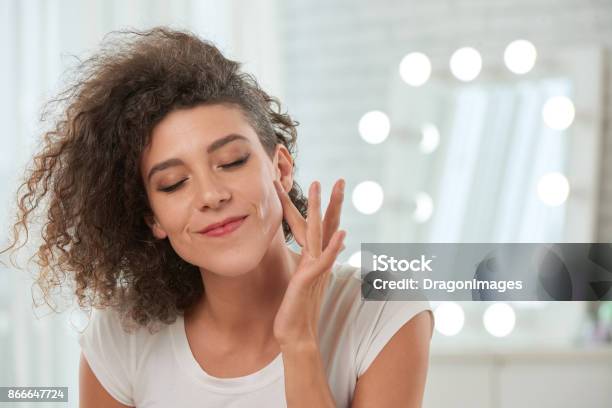 Enjoying Smooth Skin Stock Photo - Download Image Now - Moisturizer, Human Face, Women