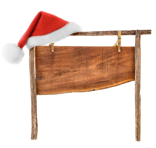 istock Santa hat on wooden sign on a rope 866647754