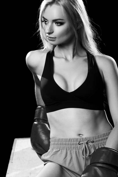 istock Woman posing in red boxing gloves 866648996