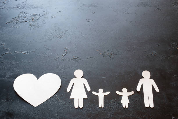 istock paper family and heart on a black background with space for text 866656032