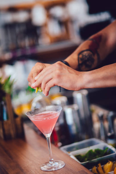 istock Hipster barman preparing cocktail at restaurant bar 866661092