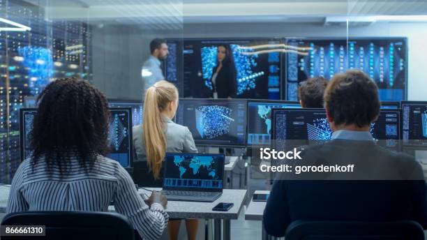 Multiethnic Team Of Research Engineers Neural Network Architects Programmists Working On A Machine Learning Neural Network Building Project Office Displays Show Working Model Of Neural Network Stock Photo - Download Image Now
