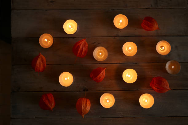 istock Burning candles with plant decorations  in the darkness. 866667134