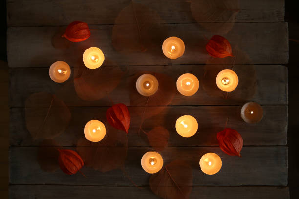 istock Burning candles with plant decorations  in the darkness. 866668188