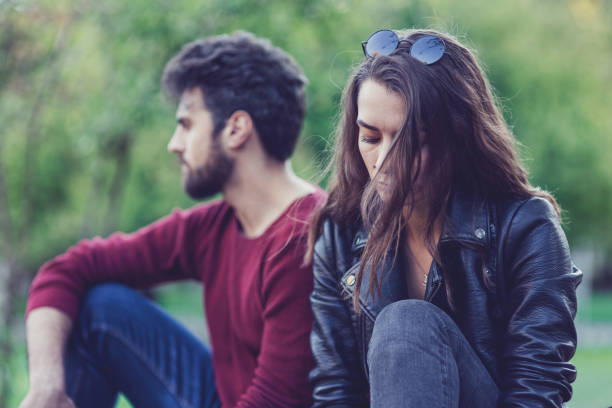 istock Young couple standing at a distance from each other 866671892