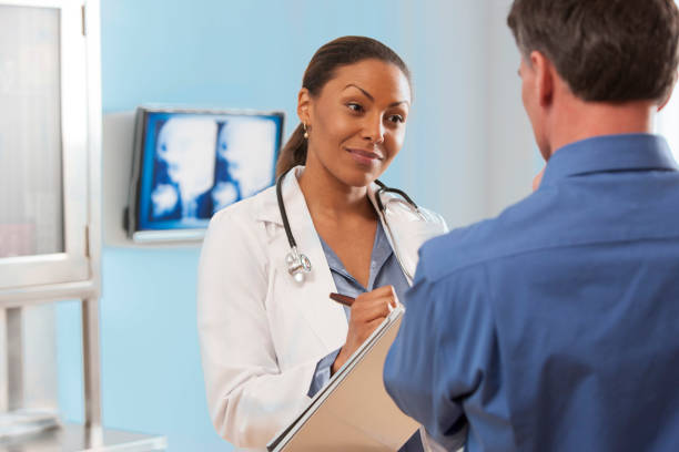 istock Female doctor talking with patient. 866671958