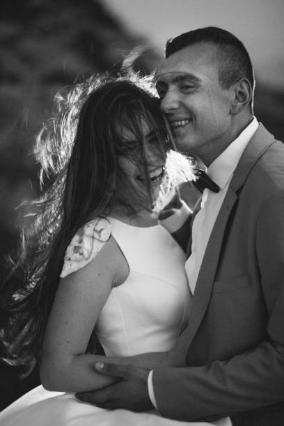 istock Romantic couple standing together holding hands in the mountains 866680592