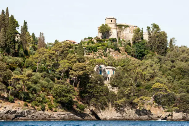 Photo of Portofino, Liguria Italia -  watching the coast from the sea. View of the villas of Portofino, one of the most popular village on the Italian Riviera.