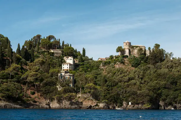 Photo of Portofino, Liguria Italia -  watching the coast from the sea. View of the villas of Portofino, one of the most popular village on the Italian Riviera.