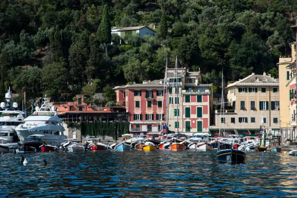 Photo of Portofino, Liguria Italia - watching the coast from the sea. View of the bay of Portofino, one of the most popular village on the Italian Riviera.