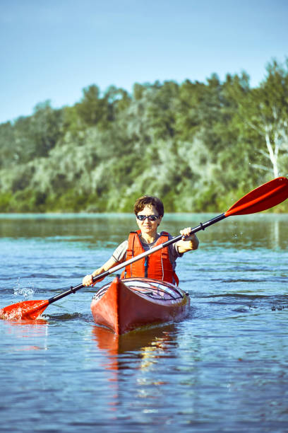 istock A canoe trip along the river along the forest in summer. 866685868