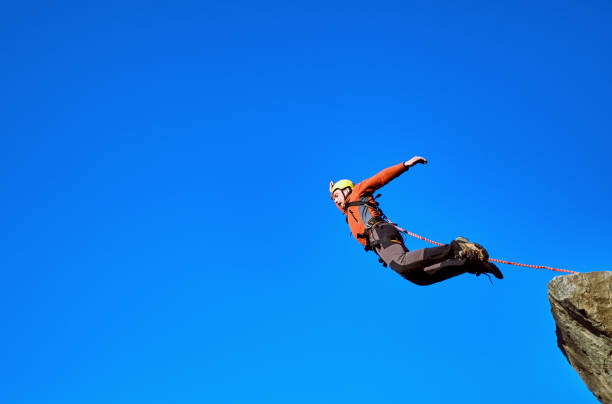 istock Jump off the cliff with a rope. 866692738