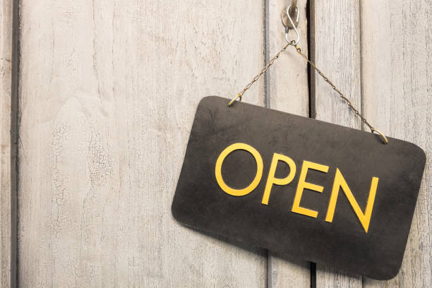istock OPEN sign on old wood door. 866696526