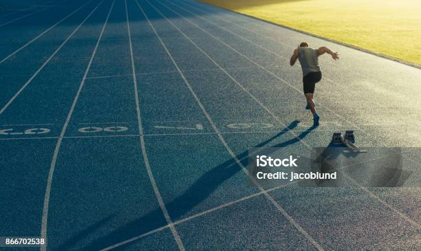 Sprinter Running On Track Stock Photo - Download Image Now - Running, Beginnings, Running Track