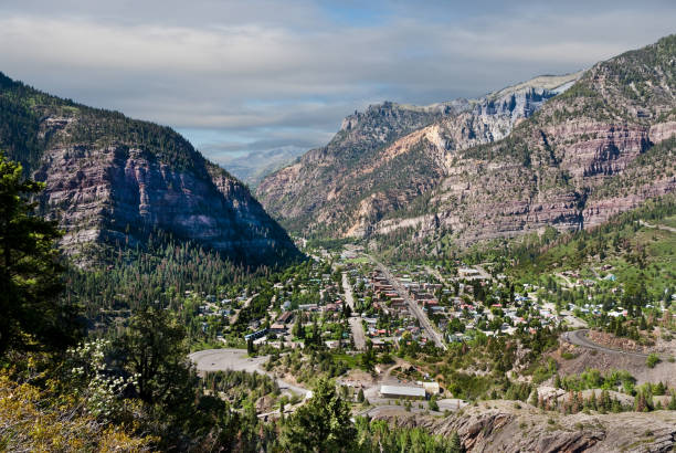 Historic Mining Town of Ouray The historic mining town of Ouray is nestled below the tall peaks of the Rocky Mountains. This overview of Ouray was taken from the Hutton Mine Trail in the Uncompahgre National Forest, Colorado, USA. jeff goulden san juan mountains stock pictures, royalty-free photos & images