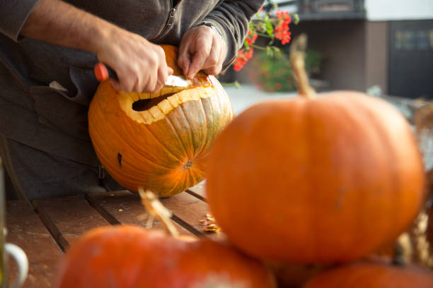 istock Carving out a pumpkin to prepare halloween lantern 866706146