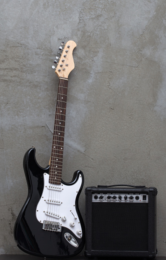 Electric black guitar on a white background