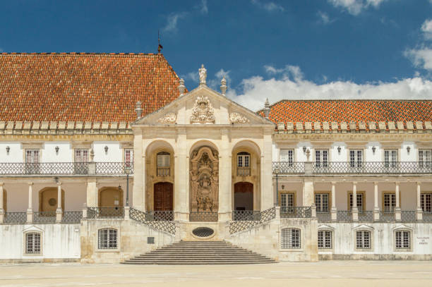 University of Coimbra, Portugal University of Coimbra, Portugal. People are croosing the central square. Some trees in the foreground. Sunny day. coimbra city stock pictures, royalty-free photos & images