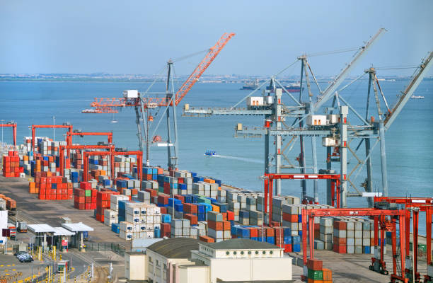 istock Industrial sea port with containers and cranes. 866721804