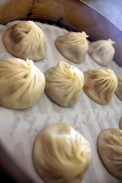 istock Shanghai Chinese steamed dumplings in a bamboo steamer 866728432