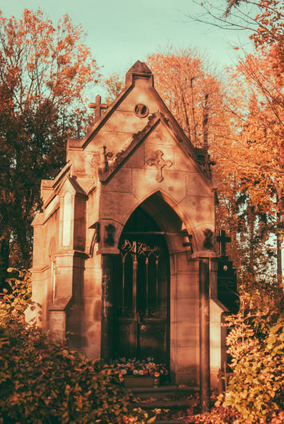 istock Ancient chapel on the cemetery on sunny autumn aftetnoon. 866735382
