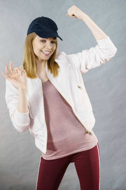 istock Young woman showing her arm muscles 866738914