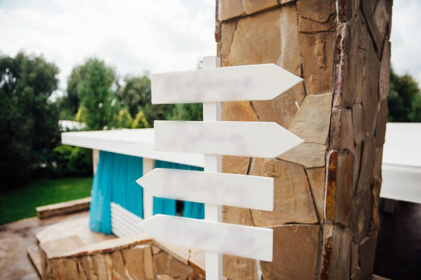 istock wedding ceremony in park. Focus on wooden pointer 866739946