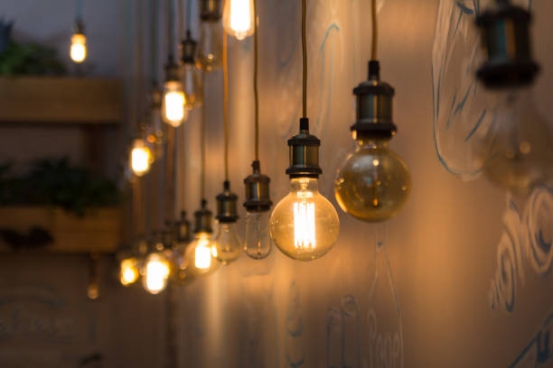 istock Vintage style light bulbs in interior of restaurant 866742592