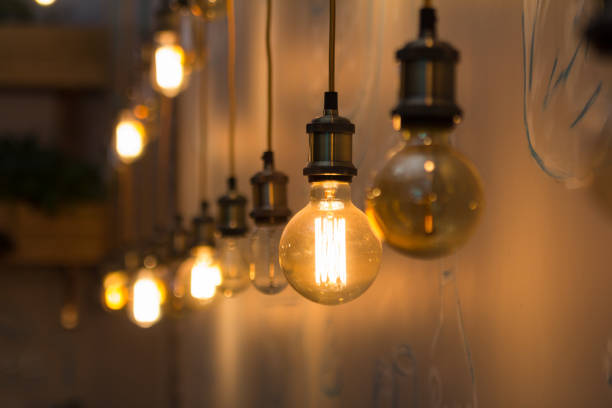 istock Vintage style light bulbs in interior of restaurant 866742648