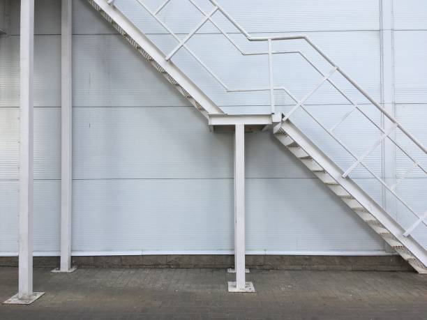 istock staircase white stairs against the wall metal 866754046