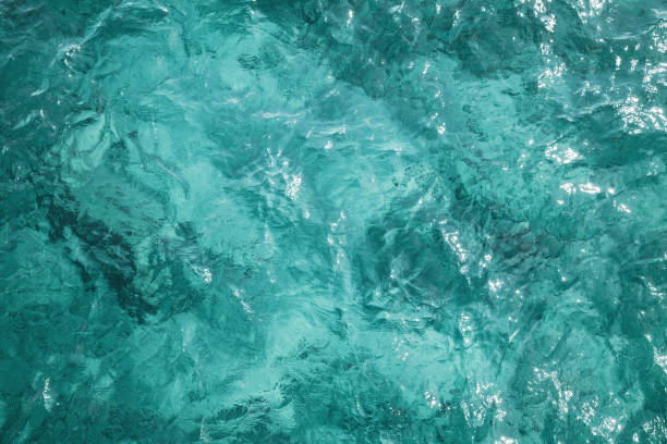 Blue ocean water surface, background photo Blue ocean water surface, background photo texture, top view turquoise ocean stock pictures, royalty-free photos & images