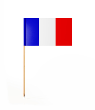 Tiny cocktail stick flag of France. With clipping path.