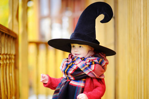 istock Toddler boy in pointed hat playing outdoors 866764370