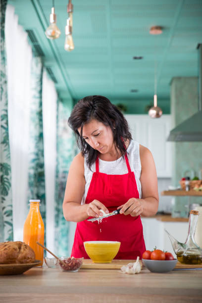 istock woman chef preparing a recipe 866764764