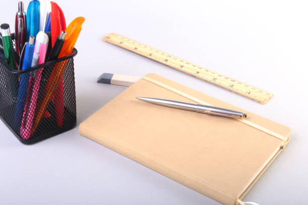 istock Colorful notebooks and office supplies on white table. 866770908