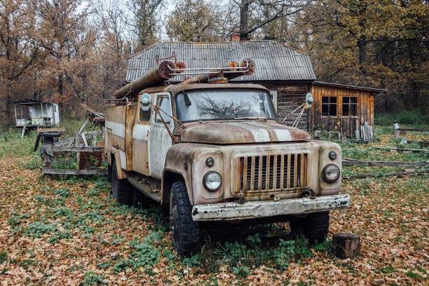 istock Old rusty abandoned Soviet fire truck in the village 866772686