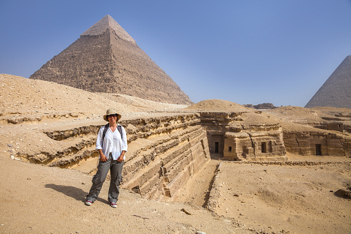 A tourist lady in front of the pramits in Egypt.