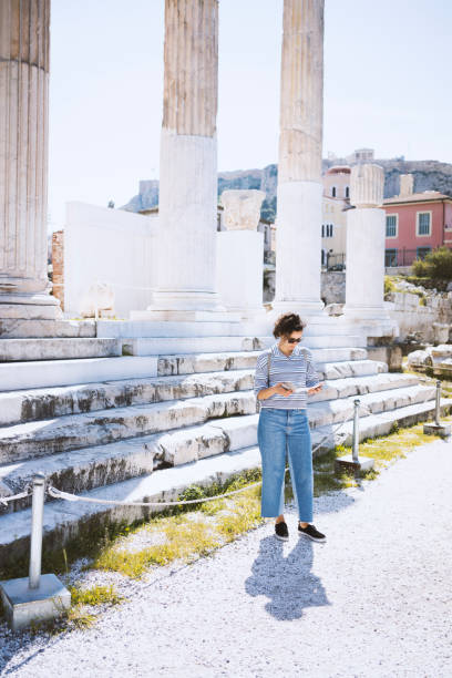istock Young woman visiting historic places in Athens 866774842