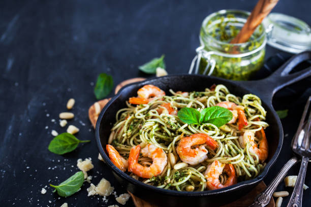 istock Spaghetti with prawns and homemade pesto sauce 866779816