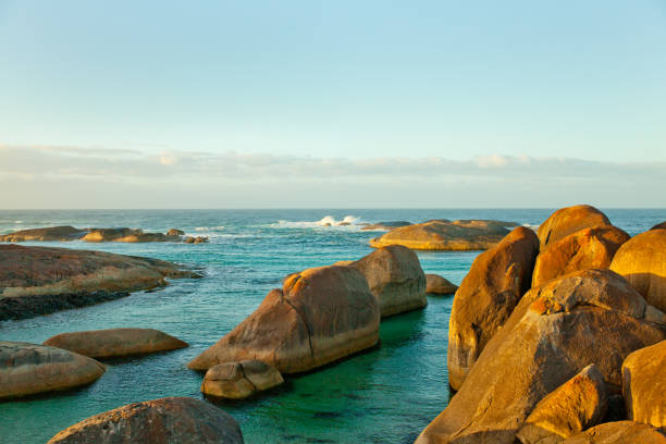 the famous elephant rocks of western australia in the ocean with clear side light during sun rise