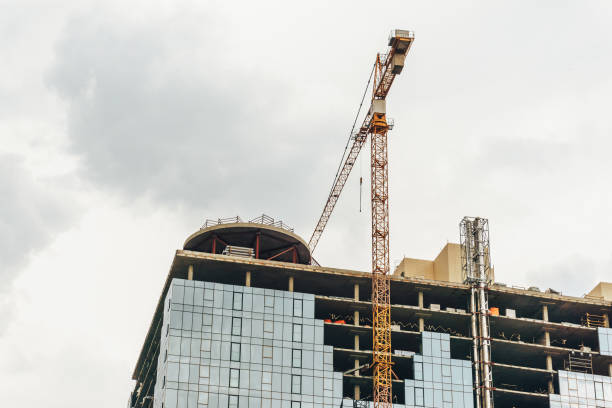 istock Construction of a new modern building, Large crane 866786156