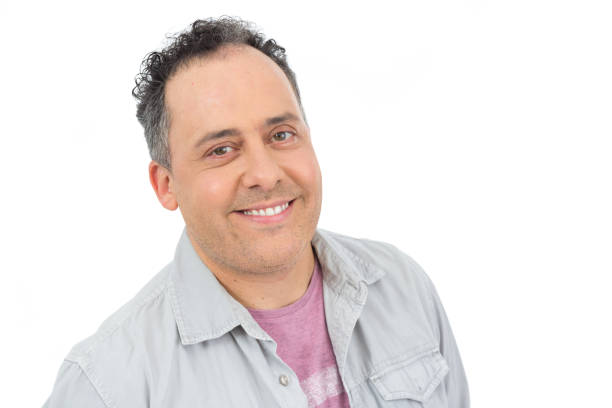 istock Friendly man with a nice smile. He is bald and wearing a gray shirt. Isolated on white background. 866795566