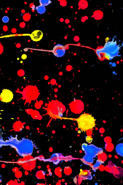istock Colorful paint splashes on black, closeup 866799494